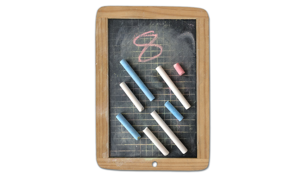 Eight chalks arrange diagonally on a children's blackboard