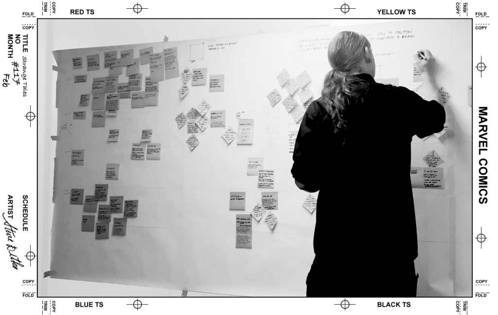 Developer drawing up a plan of a customer journey at a kick off meeting